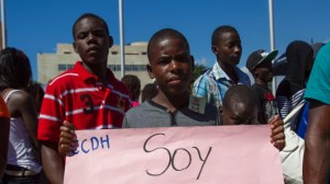478165227-dominicans-of-haitian-descent-protest-outside-the-house.jpg.CROP.rtstory-large