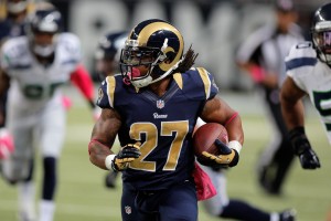 Oct 19, 2014; St. Louis, MO, USA; St. Louis Rams running back Tre Mason (27) carries the ball during the first half of a football game at the Edward Jones Dome. Mandatory Credit: Scott Kane-USA TODAY Sports